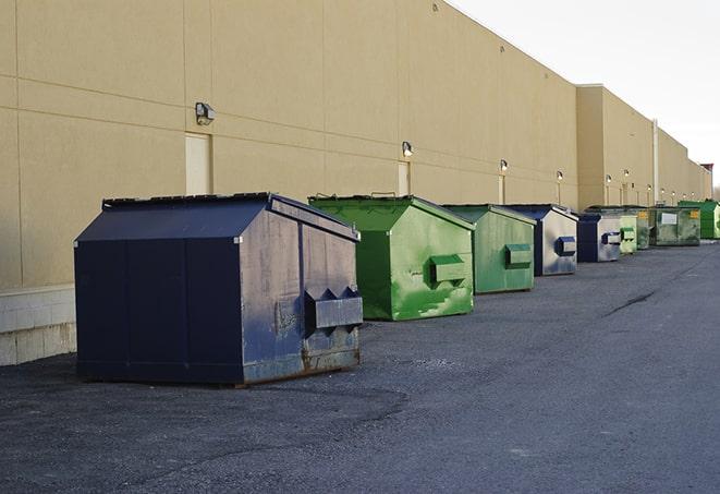 a row of industrial dumpsters at a construction site in Central Falls RI